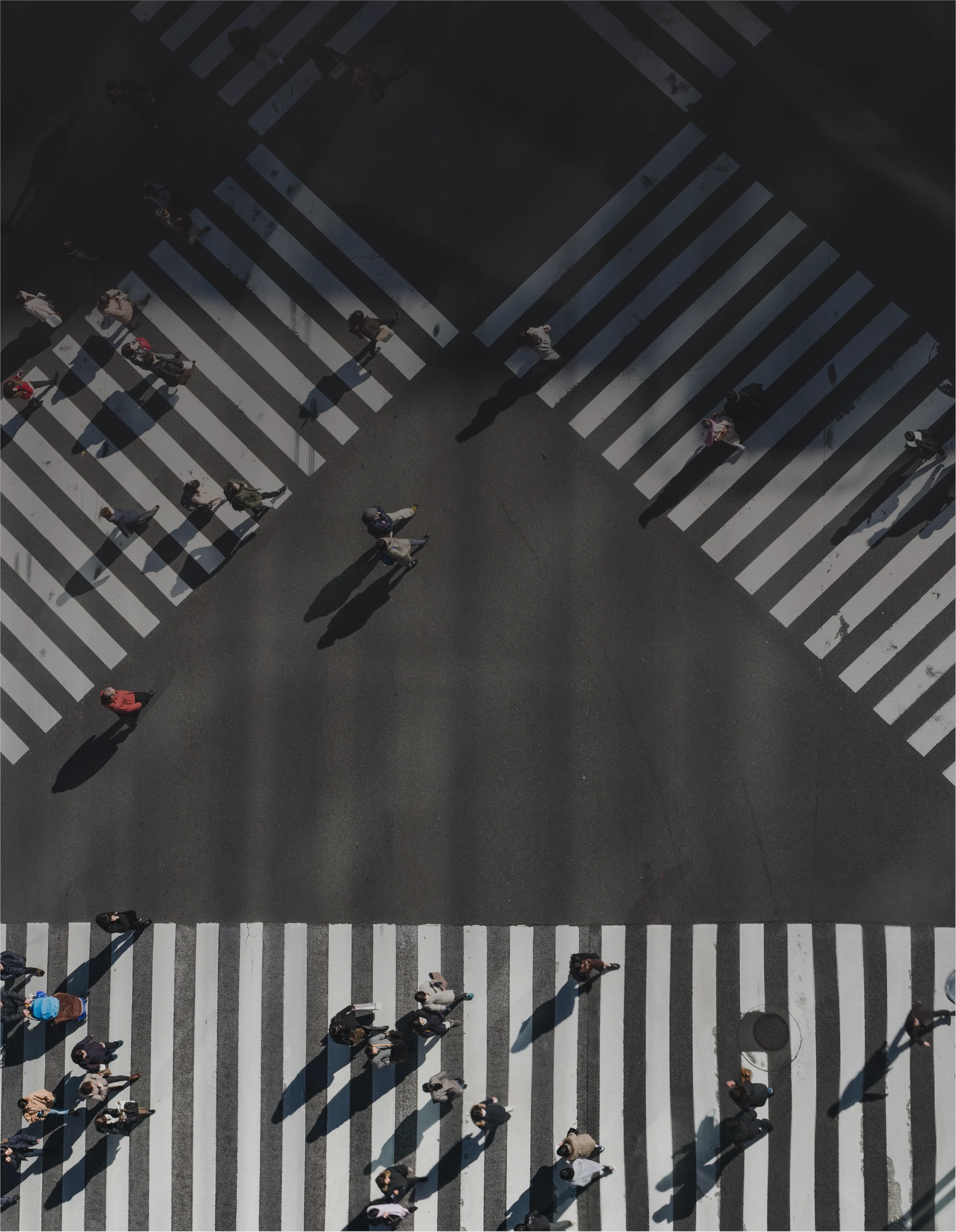 a group of people crossing a street